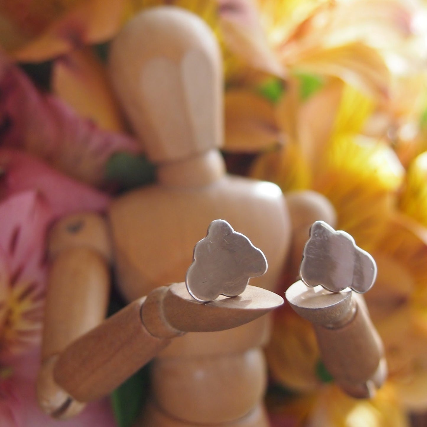 A pair of beautiful simple cloud stud earrings, handmade in solid silver.