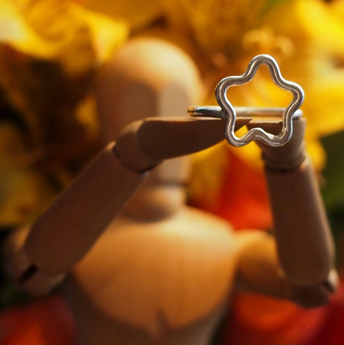 An adorable perfectly simple sterling silver wire star ring.