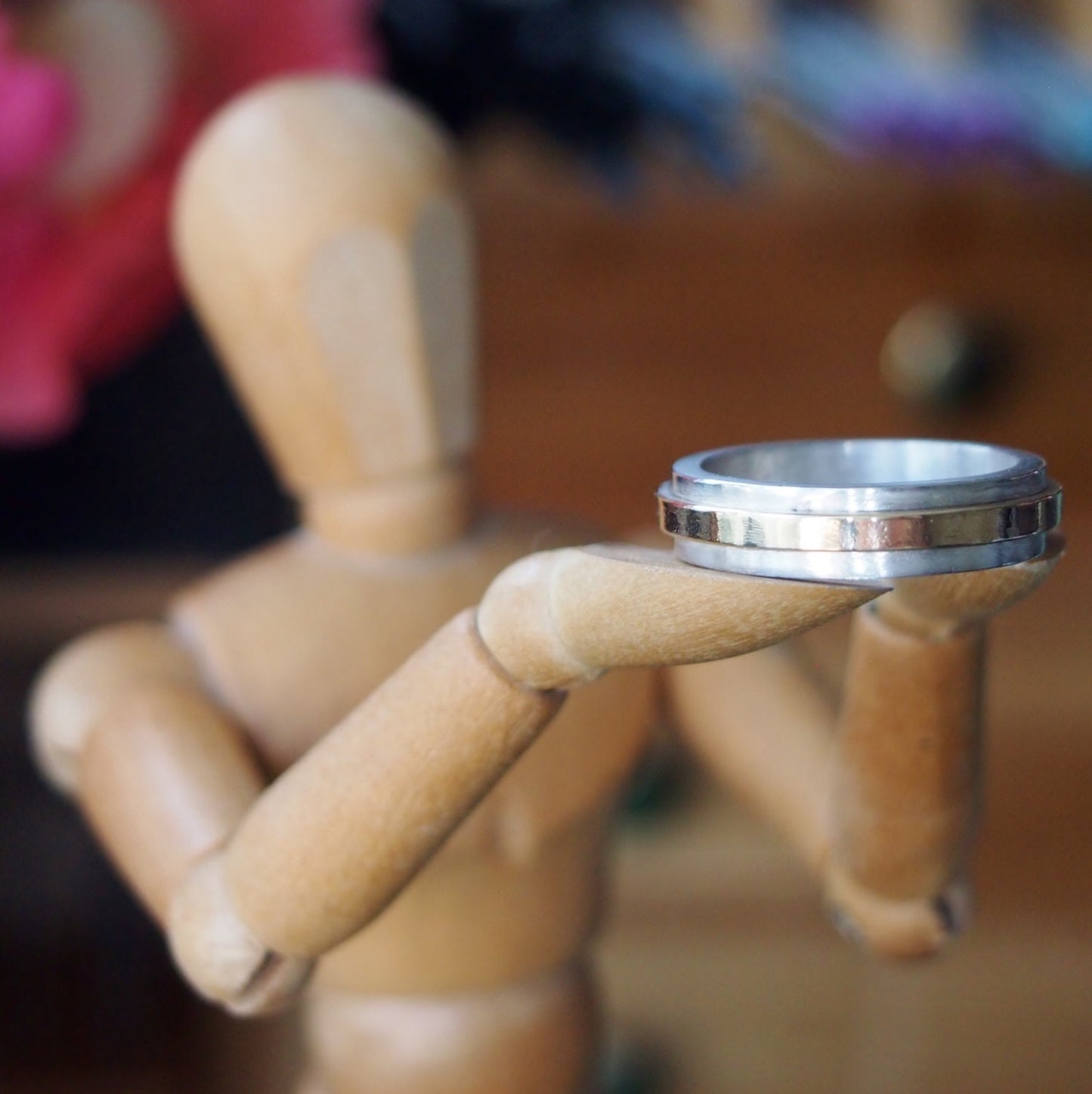 A handmade chunky band sterling silver and solid 9ct gold twiddle spinner ring.