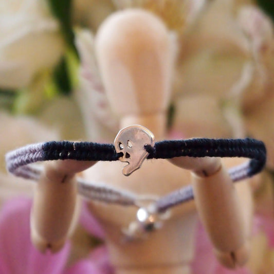 A lovely black and grey leather and cotton friendship bracelet with fine silver skull.