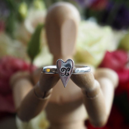 A simple fine silver heart on a beaten sterling silver ring. Sealed with a kiss?