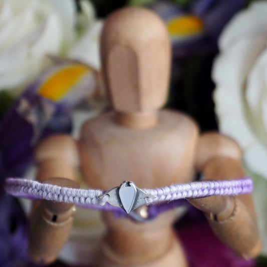 A cute unique manta ray on a purple leather, sterling silver and cotton friendship bracelet.