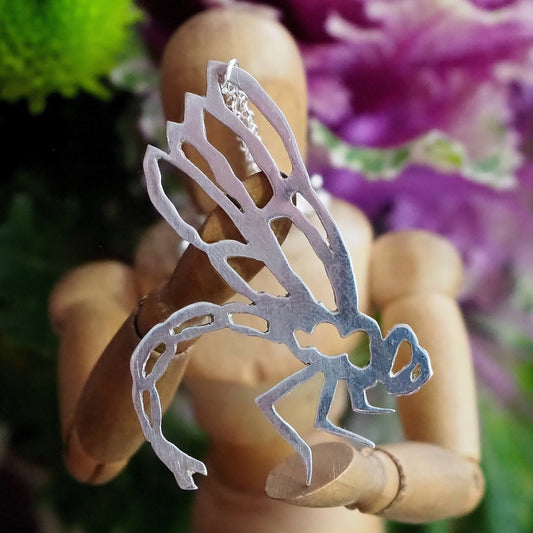 A delightfully simple unique dragonfly pendant hand cut in recycled sterling silver on a sterling silver chain.