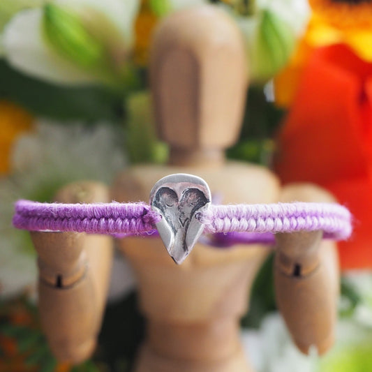 A lovely handmade fine silver owl on a purple leather, sterling silver and cotton friendship bracelet.