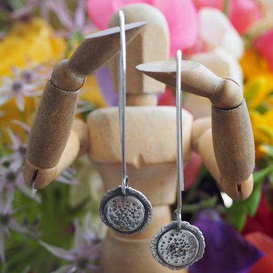 A gorgeously simple sunflower earrings handmade in fine silver and hung on long sterling silver wires.