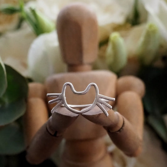 An adorable perfectly simple sterling silver kitten cat ring.