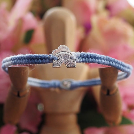 A beautiful small sized grey blues fade leather, sterling silver and cotton friendship bracelet with a tiny fine silver cloud and rainbow