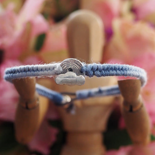 A beautiful small sized soft blues fade leather, sterling silver and cotton friendship bracelet with a tiny fine silver cloud and rainbow