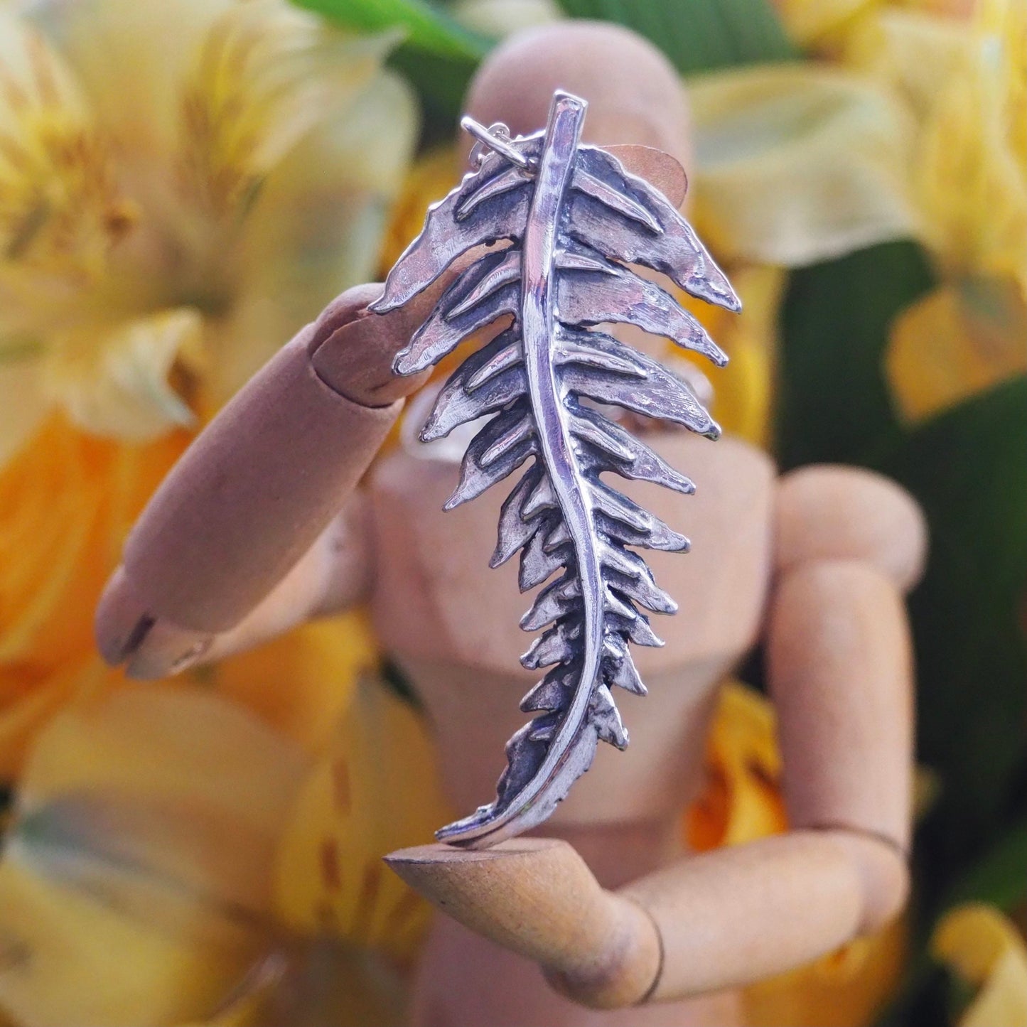 A gorgeous unique fern leaf handmade in eco friendly fine silver on a sterling silver necklace.