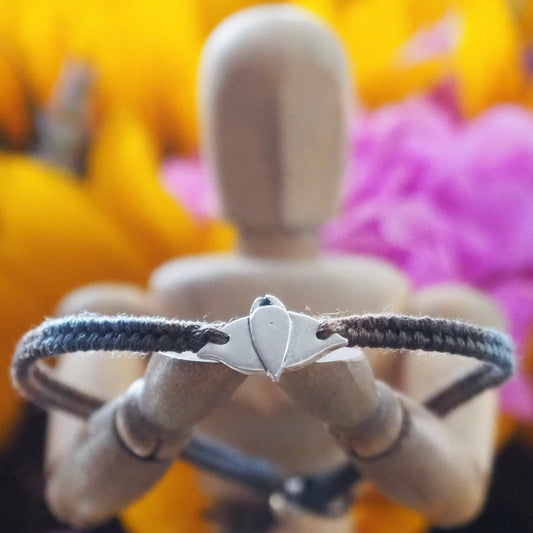 A cute unique manta ray on a blues and browns leather, sterling silver and cotton friendship bracelet.