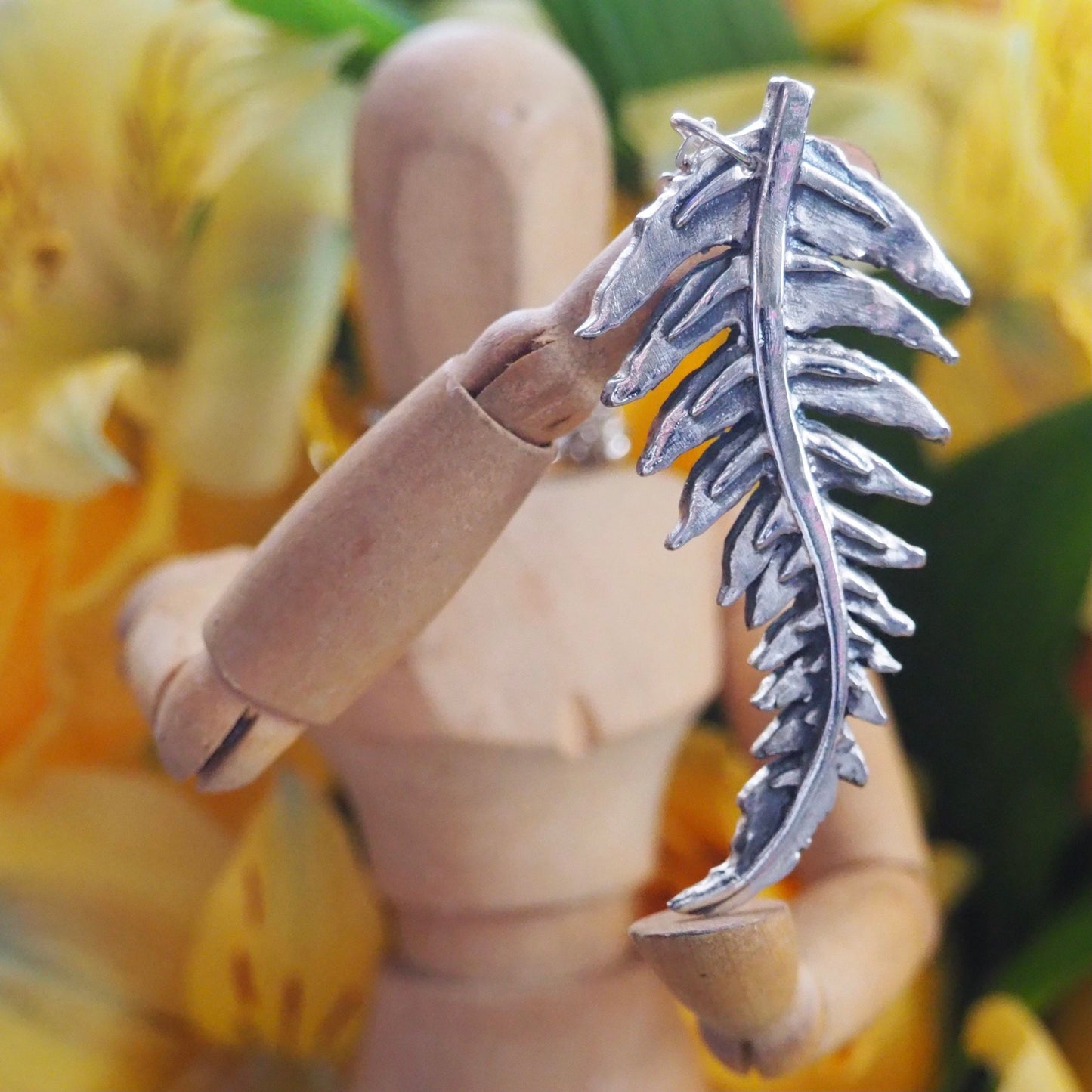 A gorgeous unique fern leaf handmade in eco friendly fine silver on a sterling silver necklace.