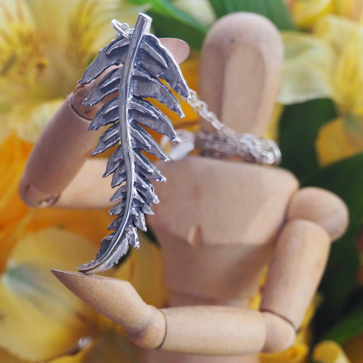 A gorgeous unique fern leaf handmade in eco friendly fine silver on a sterling silver necklace.