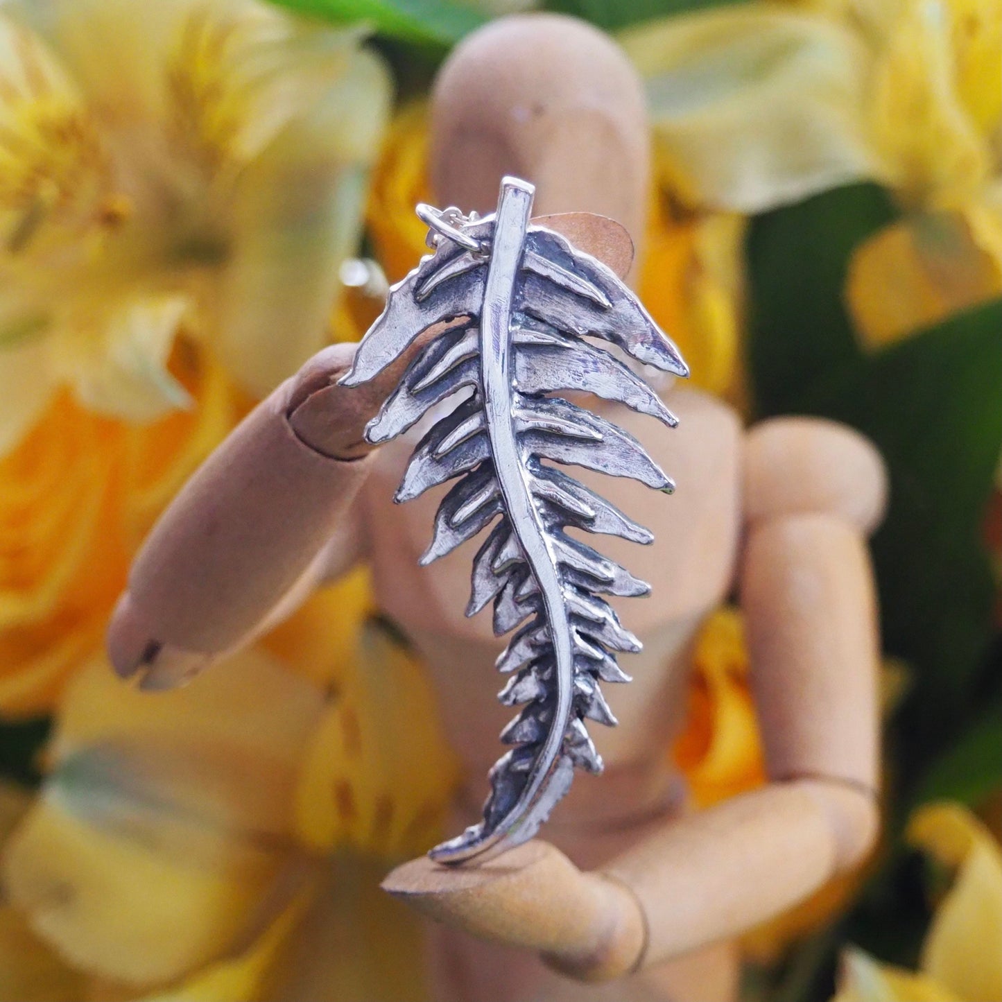 A gorgeous unique fern leaf handmade in eco friendly fine silver on a sterling silver necklace.