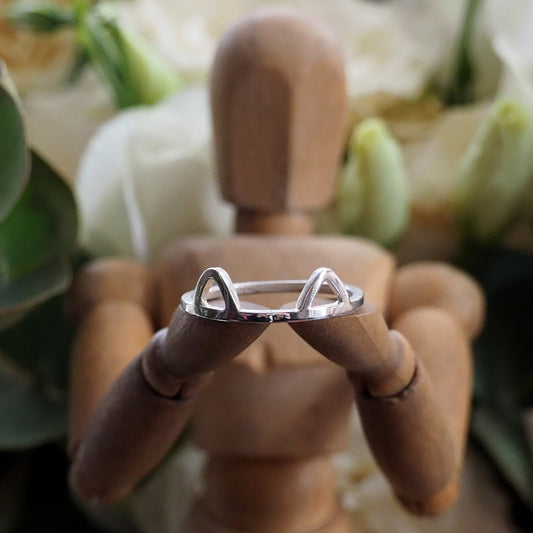 A purrfectly adorable simple sterling silver square wire ring with cat ears.