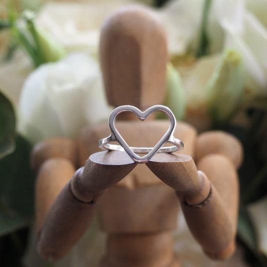 A perfectly simple hand made sterling silver wire heart ring.