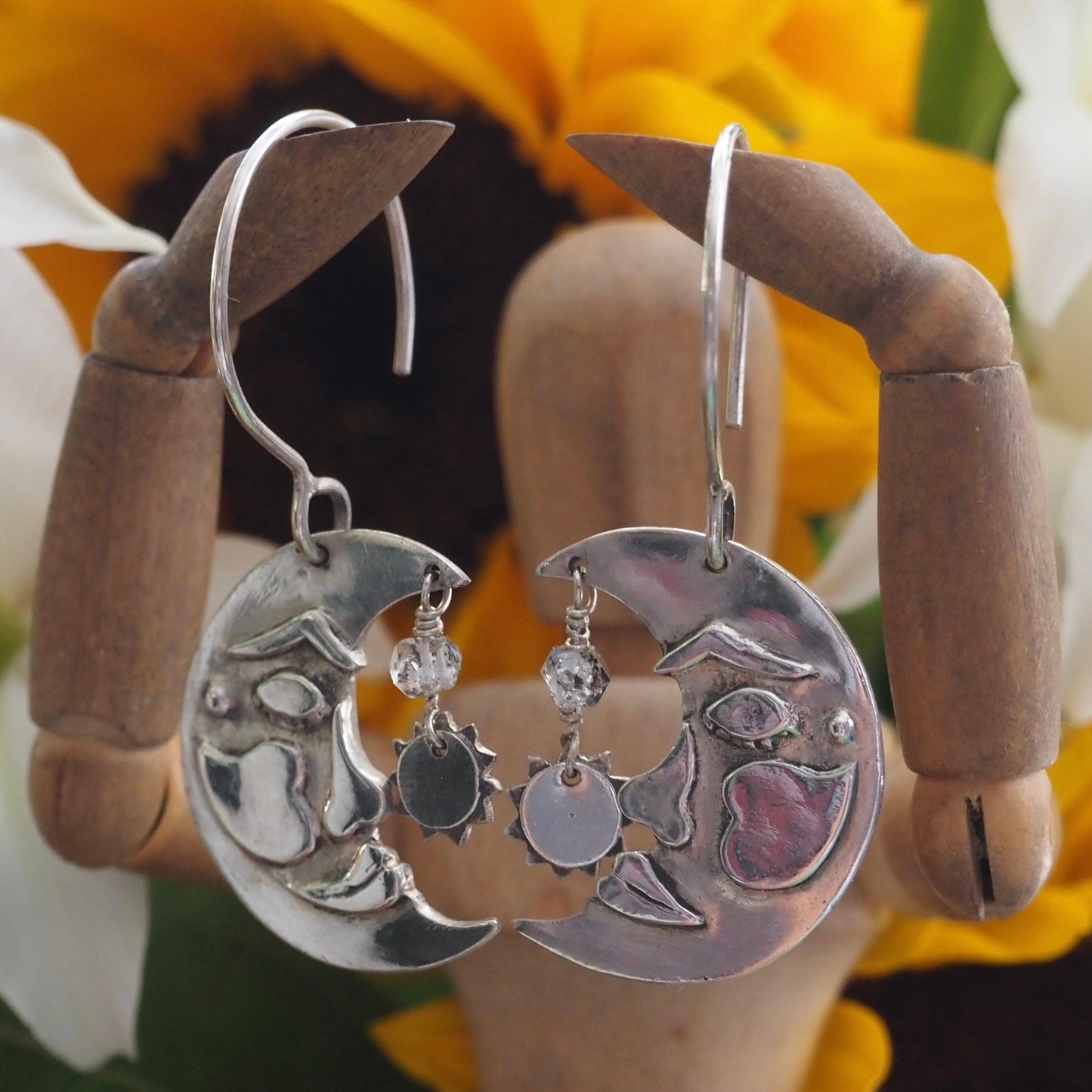 A lovely pair of handmade fine silver moon and sun earrings on sterling silver wires embellished with Herkimer diamonds.