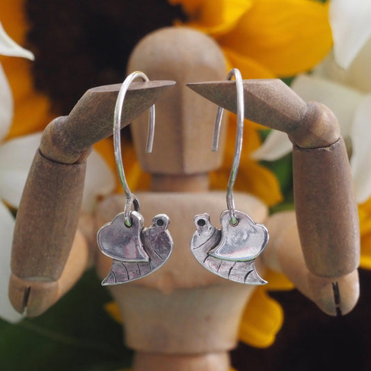 An adorable pair of fine silver little bumble bee earrings on sterling silver wires.