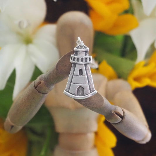 A super cute unique little fine silver lighthouse pendant.