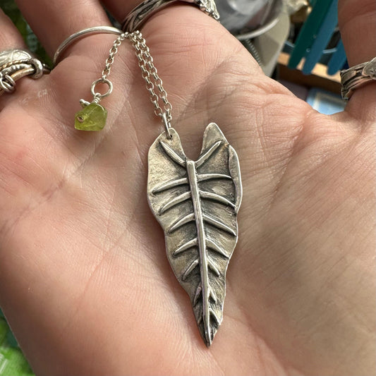 A gorgeous unique philodendron leaf handmade in eco friendly fine silver on a sterling silver necklace.