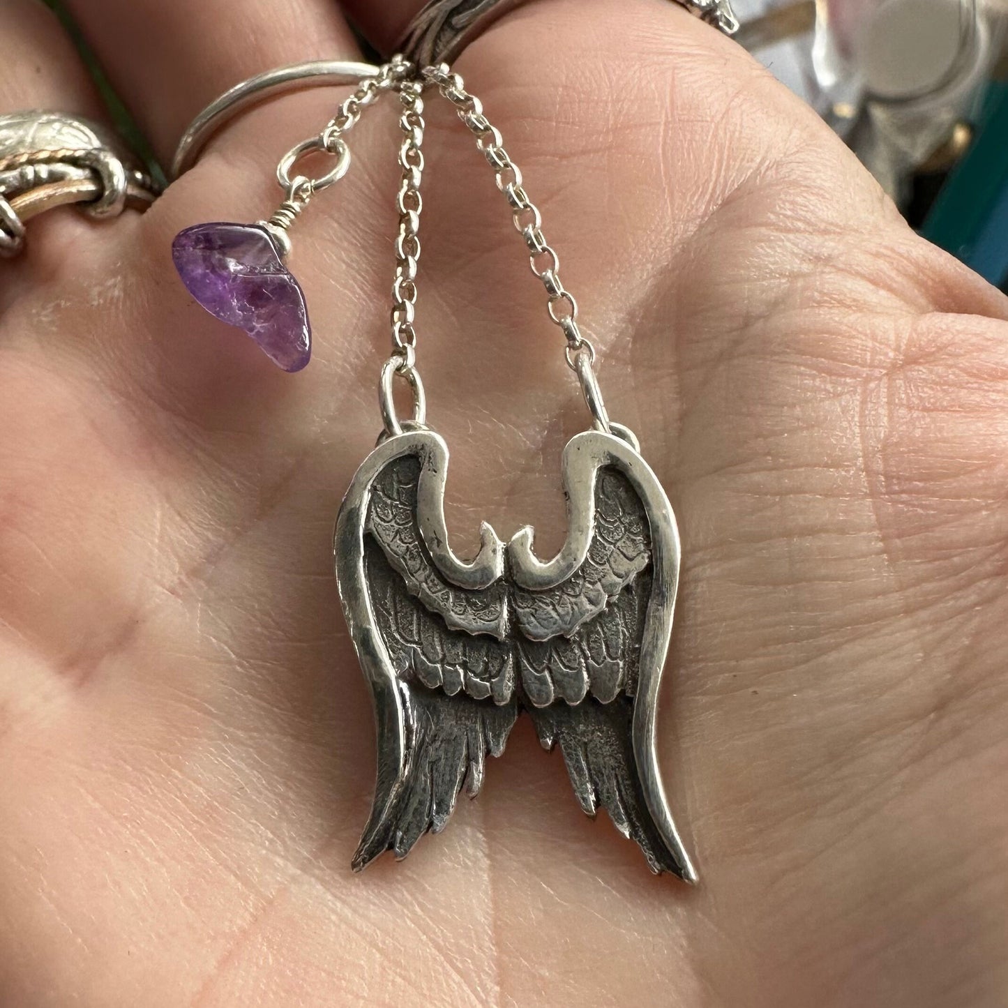 A beautiful  simple fine silver pair of handmade  angel wings necklace on a sterling silver chain.