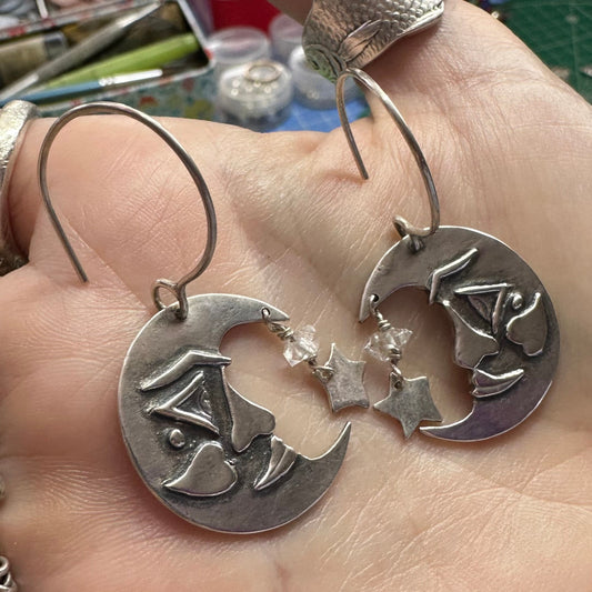 A gorgeous pair of handmade fine silver moon and sun/star earrings on sterling silver wires embellished with Herkimer diamonds.