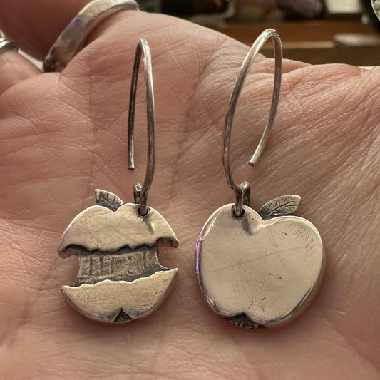 A delightful simple pair of apple and core earrings handmade in solid silver hung on sterling silver hooks.