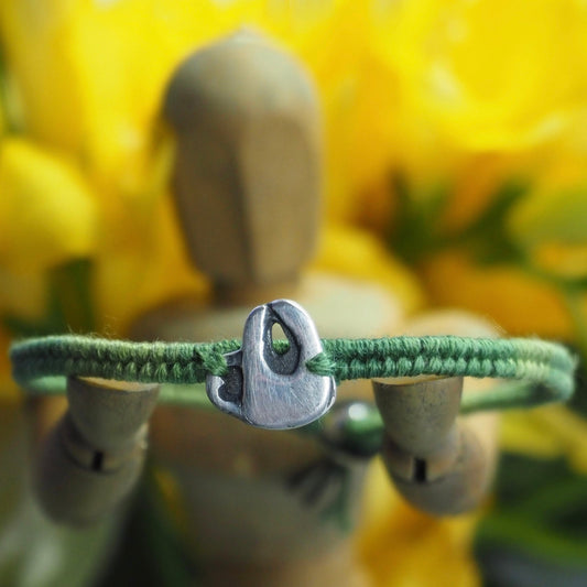 A lovely handmade fine silver sloth on a beautiful green leather, sterling silver and cotton friendship bracelet…