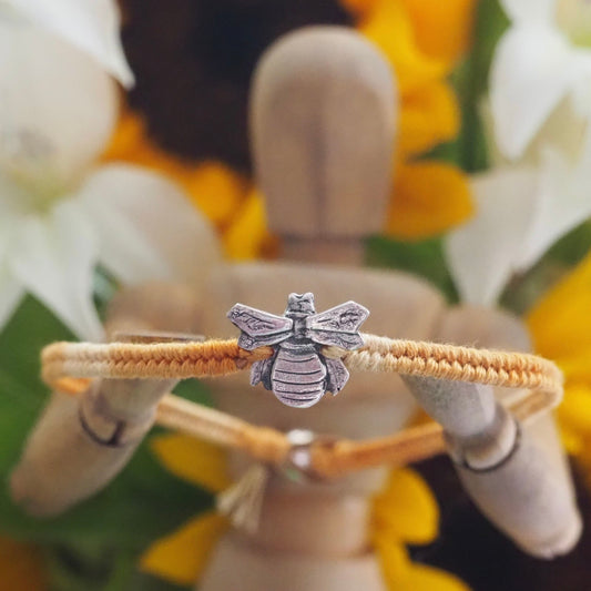 A delightful little honey bee handmade in fine silver on a soft yellow leather, sterling silver and cotton friendship bracelet.