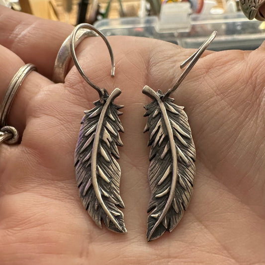 A wonderful pair of handmade fine silver curved feathers on sterling silver wires