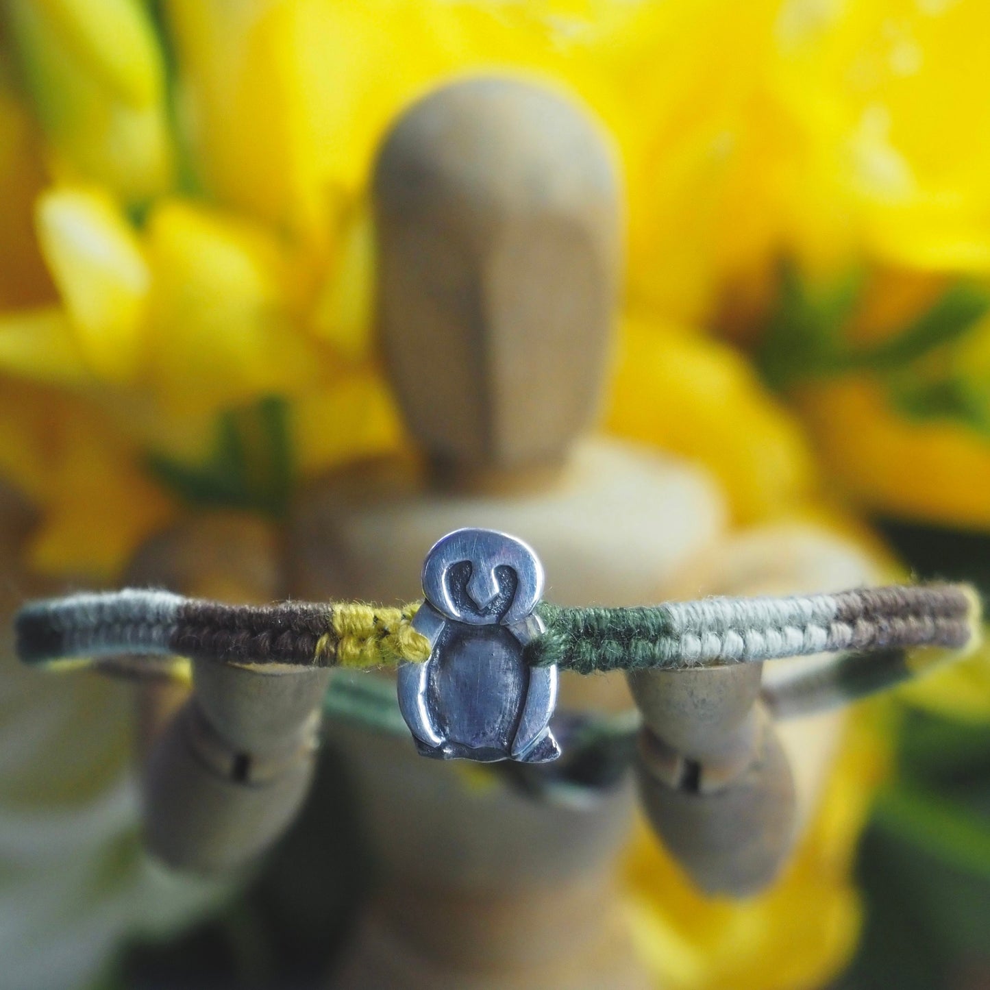 A lovely handmade fine silver owl on a soft browns and green leather, sterling silver and cotton friendship bracelet.