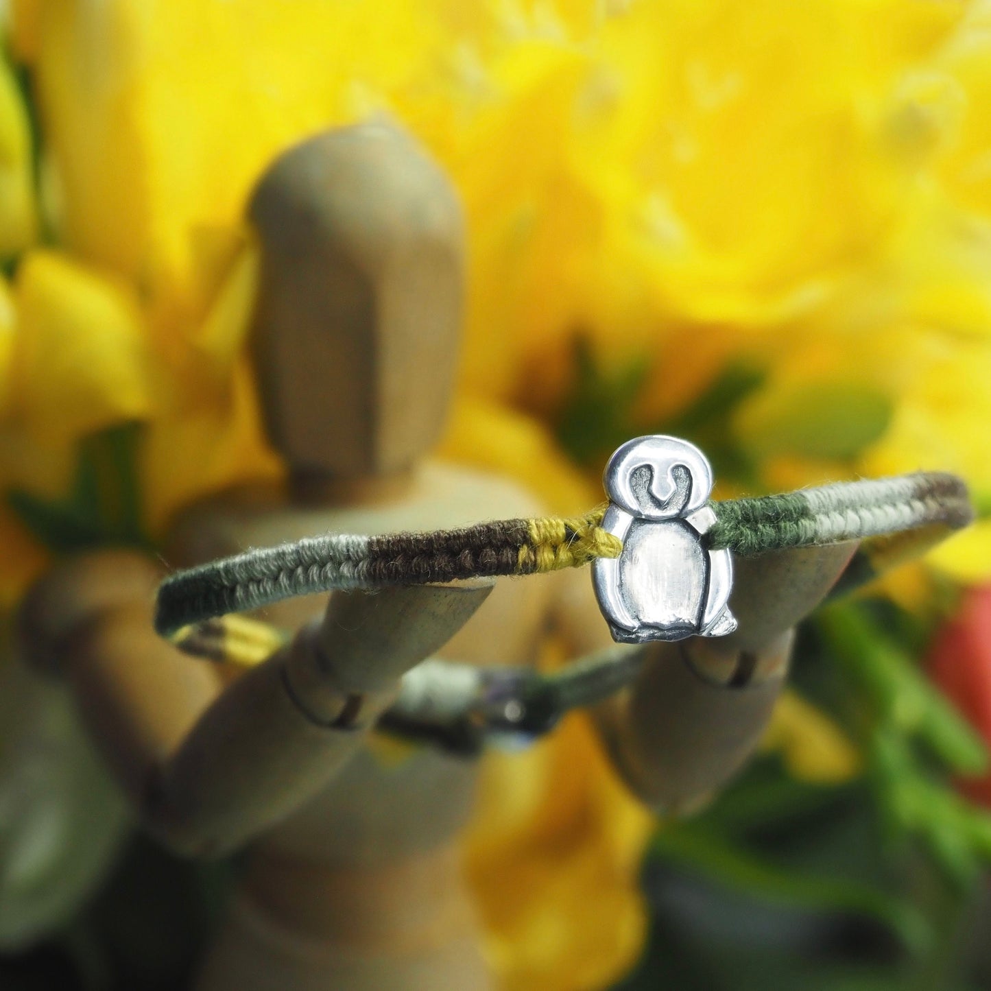 A lovely handmade fine silver owl on a soft browns and green leather, sterling silver and cotton friendship bracelet.