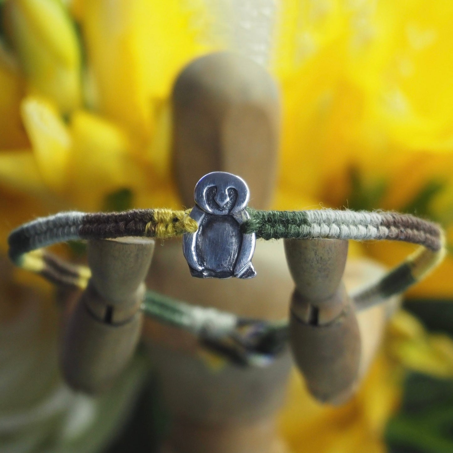 A lovely handmade fine silver owl on a soft browns and green leather, sterling silver and cotton friendship bracelet.