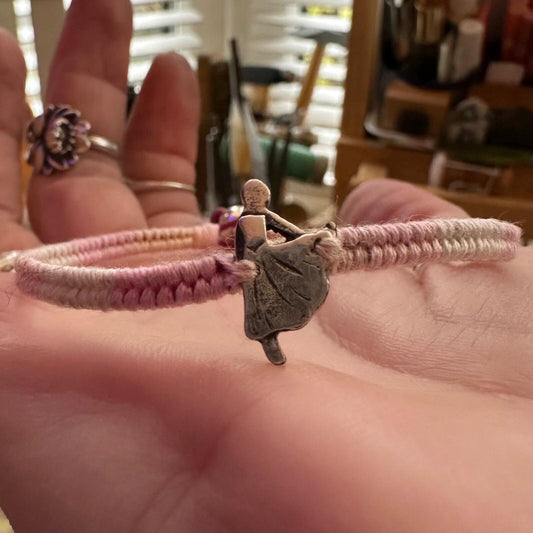 A beautiful tiny ballet dancer handmade in fine silver on a baby pinks leather, sterling silver and cotton woven charm bracelet…