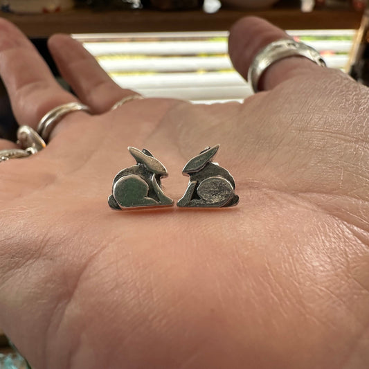 A lovely pair of tiny handmade fine silver rabbit stud earrings set on sterling silver pins.