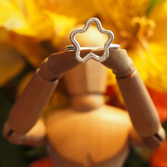 An adorable perfectly simple sterling silver wire star ring.